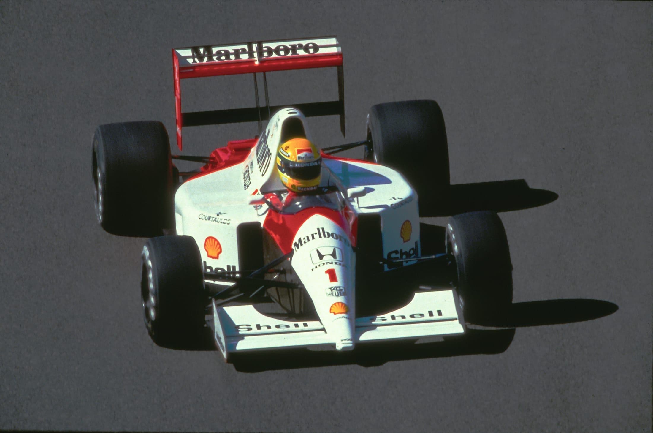 Formula 1 car racing in wet conditions